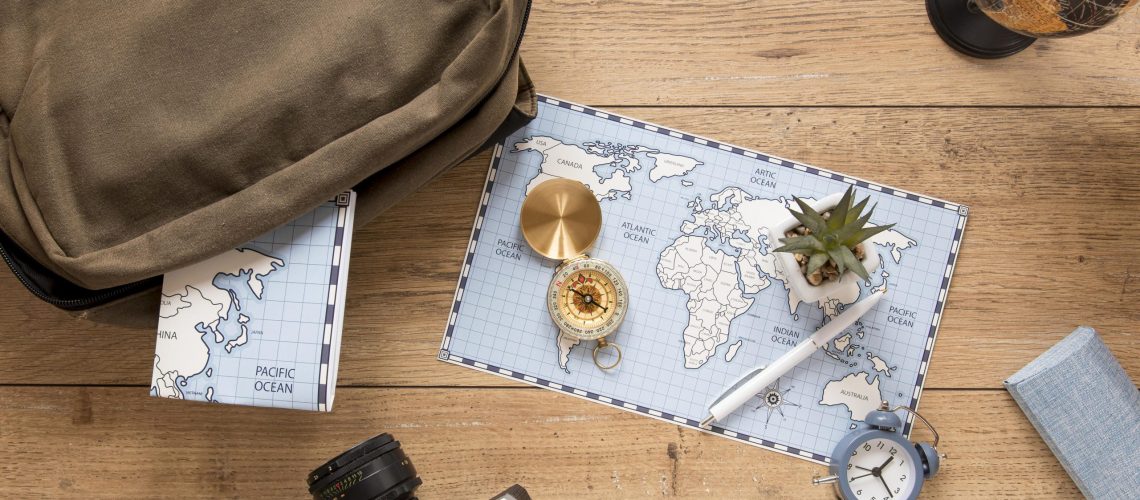 traveling-items-wooden-background